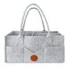 Sac de rangement à couches en feutre gris avec anses et compartiments, vue de face - Bébé Lova
