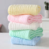 Pile de serviettes bébé épaisses en mousseline aux couleurs pastel - Bébé Lova
