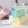Serviettes bébé en mousseline roulées avec différentes couleurs pastel - Bébé Lova