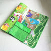 Tapis d'éveil PlayZone à moitié roulé avec son sac de transport vert - Bébé Lova