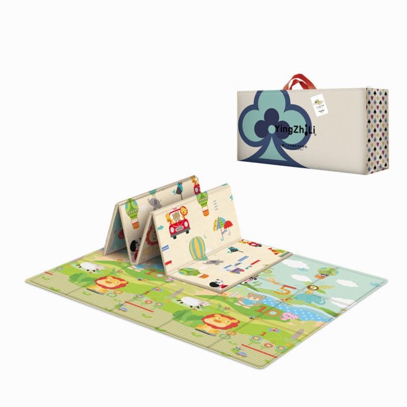 Tapis de jeu éducatif plié à côté de son coffret cadeau, face animaux et jungle déployée - Bébé Lova