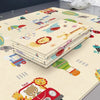 Tapis de jeu éducatif pliable double face crème plié sur le tapis déplié à motifs lion, ours, girafe, voitures et montgolfières - Bébé Lova