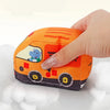 main pressant une voiture Montessori souple en tissu montrant sa texture douce et compressible - Bébé Lova